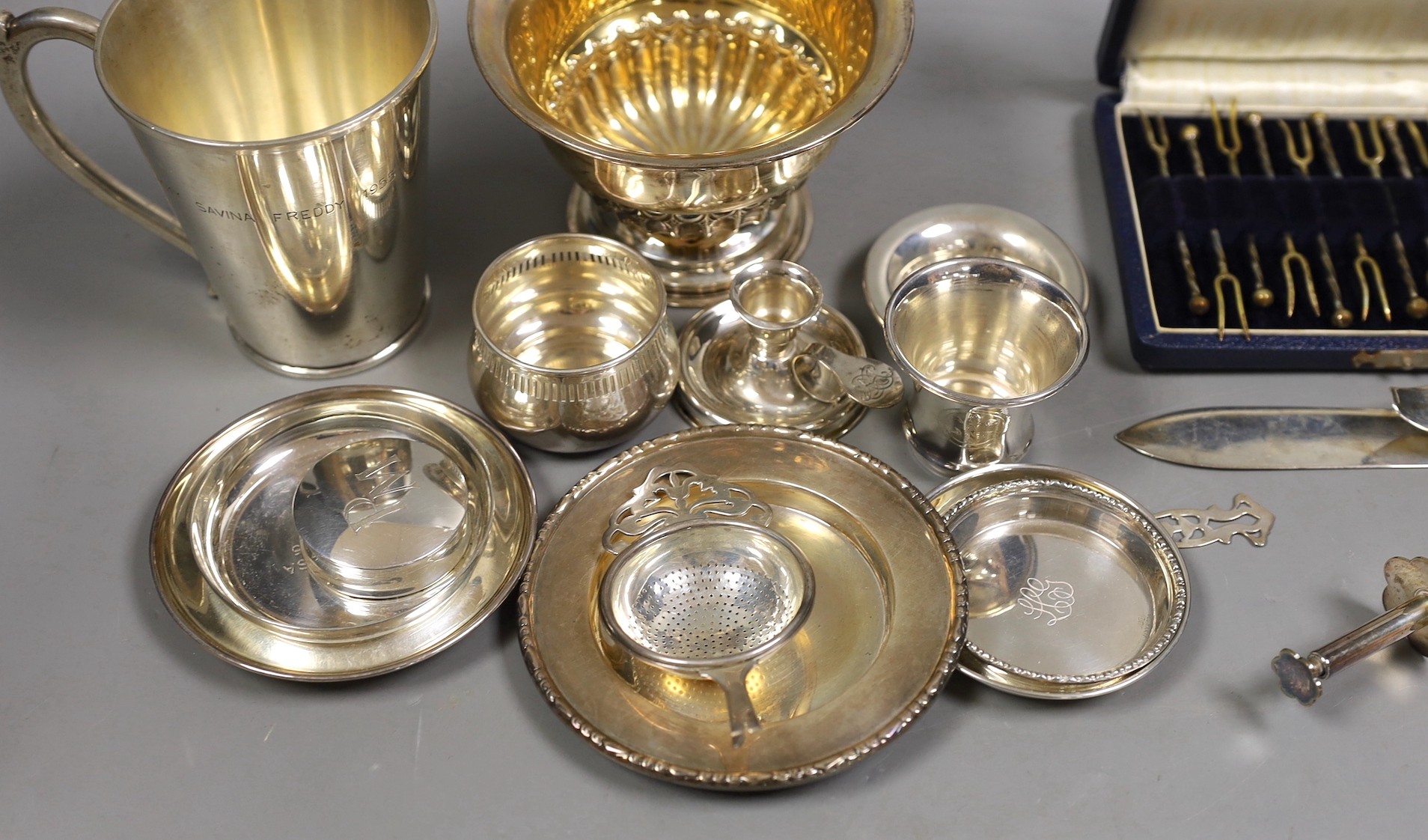 A late Victorian repousse silver pedestal bowl, Sheffield, 1898, diameter 12.8cm, three later silver dishes, a silver bowl, pill box and damaged tea strainer, eight Greek white metal items and a plated tongs.